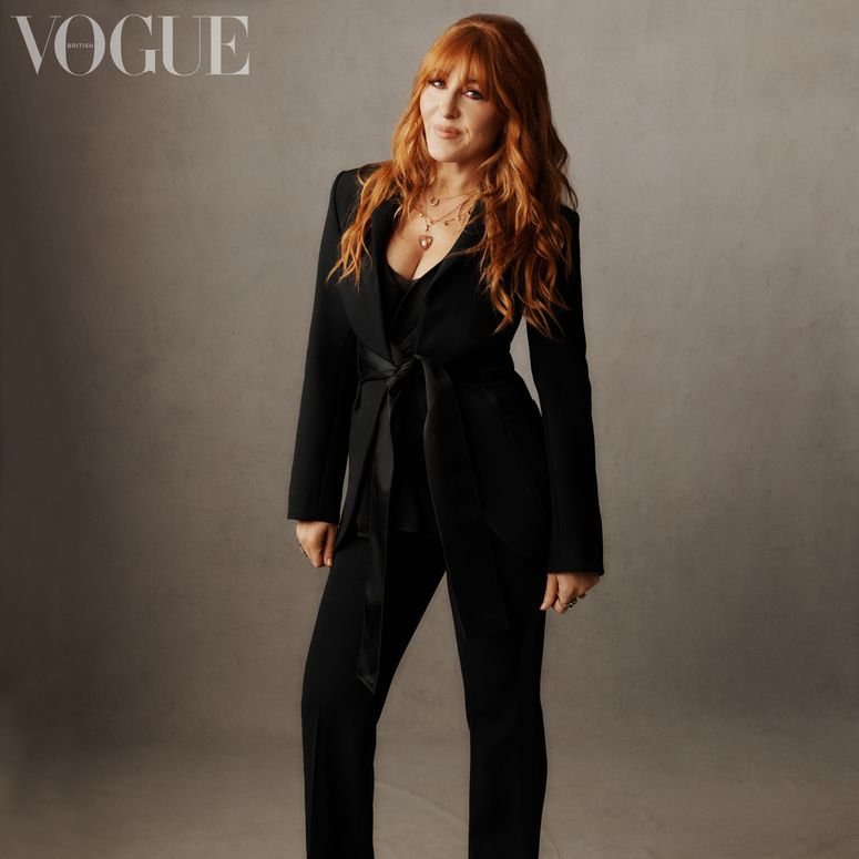 Image may contain: Clothing, Apparel, Suit, Coat, Overcoat, Human, Female, Person, Dress, Charlotte Tilbury, and Woman